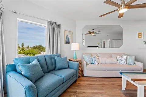 a large bed sitting in a bedroom and lamp