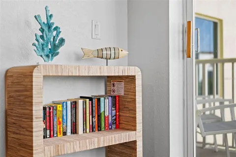 a bed sitting in a bedroom next to a bathroom