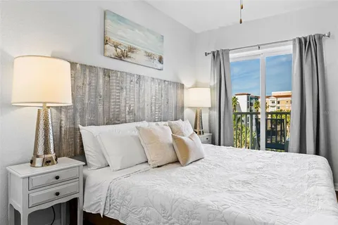 a view of a balcony with chair and front door