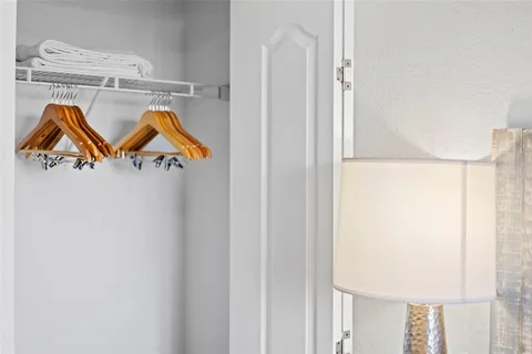 a view of balcony with wooden floor and fence