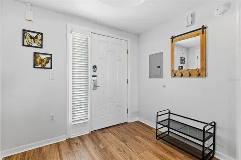 a kitchen with granite countertop white cabinets and stainless steel appliances