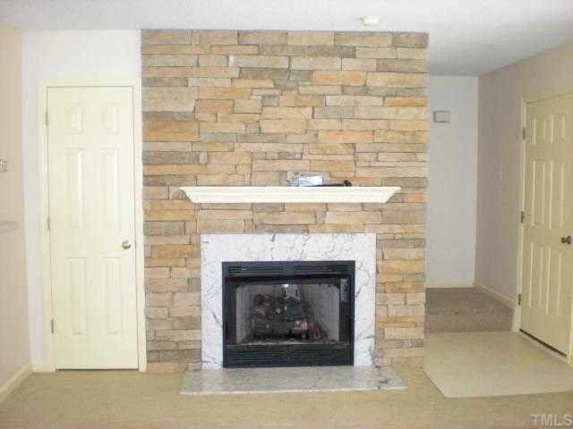 4828 Silverdene Street Raleigh, NC 27616 - Photo 2 of 7 a room with a fireplace