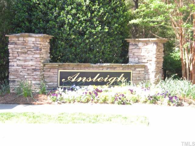 4828 Silverdene Street Raleigh, NC 27616 - Photo 7 of 7 a street sign that is sitting in front of flowers