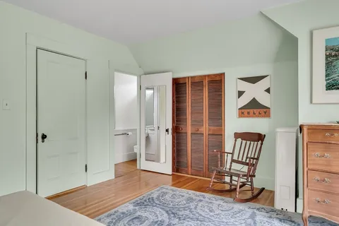 a view of room with furniture and wooden floor