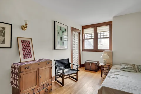 a bedroom with furniture and a window