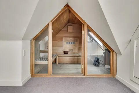 a view of an entryway with wooden floor and a window