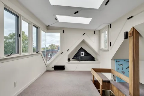 a view of a balcony with a table and chairs