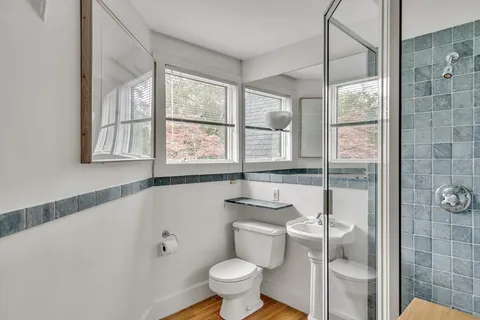 a bathroom with a sink and a window