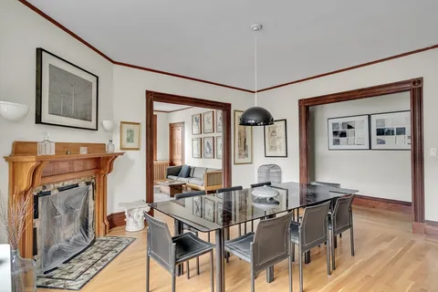 a dining room with furniture and window