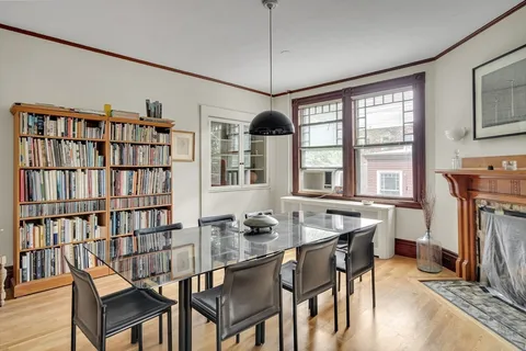 a dining room with furniture and window