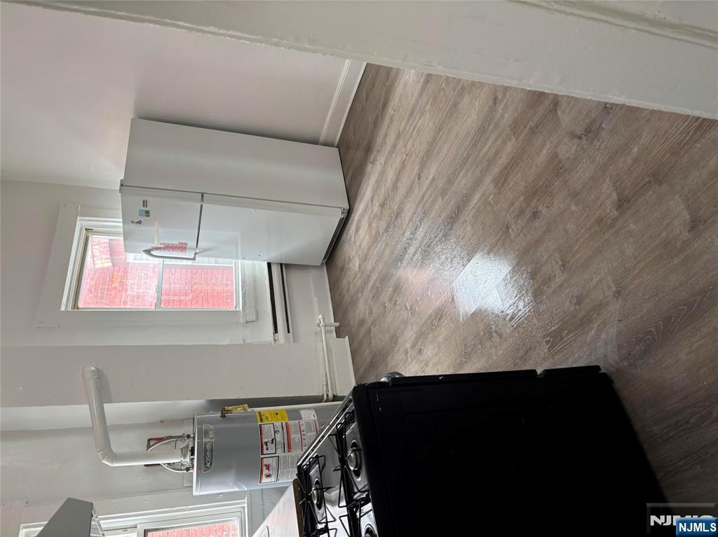 28 Fair Street, Unit 28B Hackensack, NJ 07601 - Photo 3 of 8 a kitchen with a refrigerator and a stove