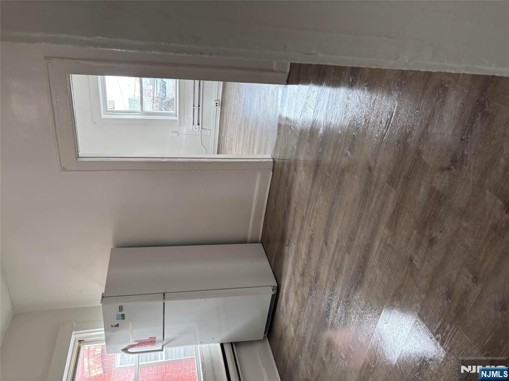 28 Fair Street, Unit 28B Hackensack, NJ 07601 - Photo 4 of 8 a view of a kitchen with wooden floor