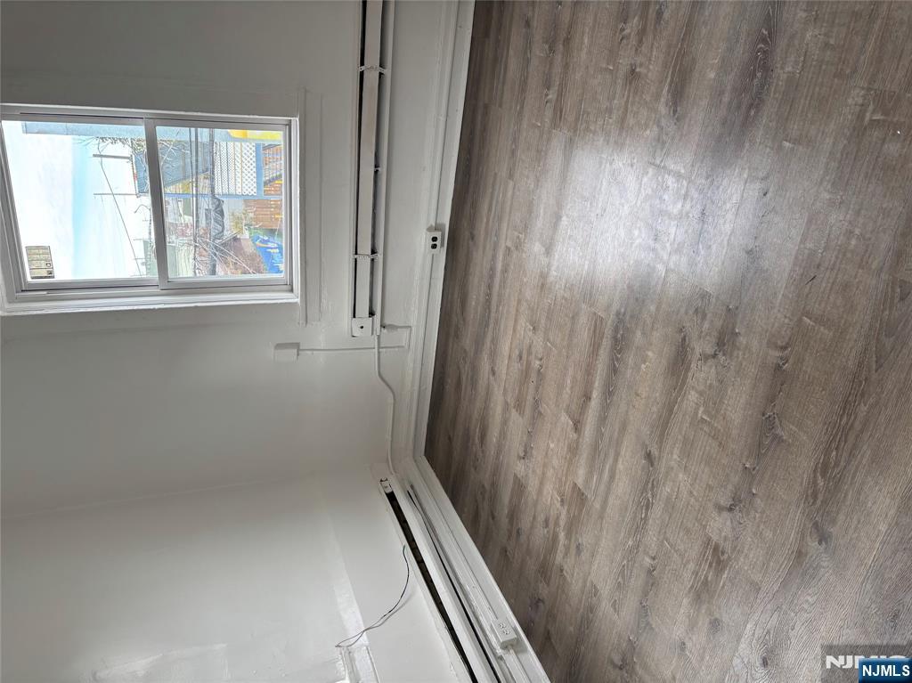 28 Fair Street, Unit 28B Hackensack, NJ 07601 - Photo 6 of 8 a view of a window in an empty room