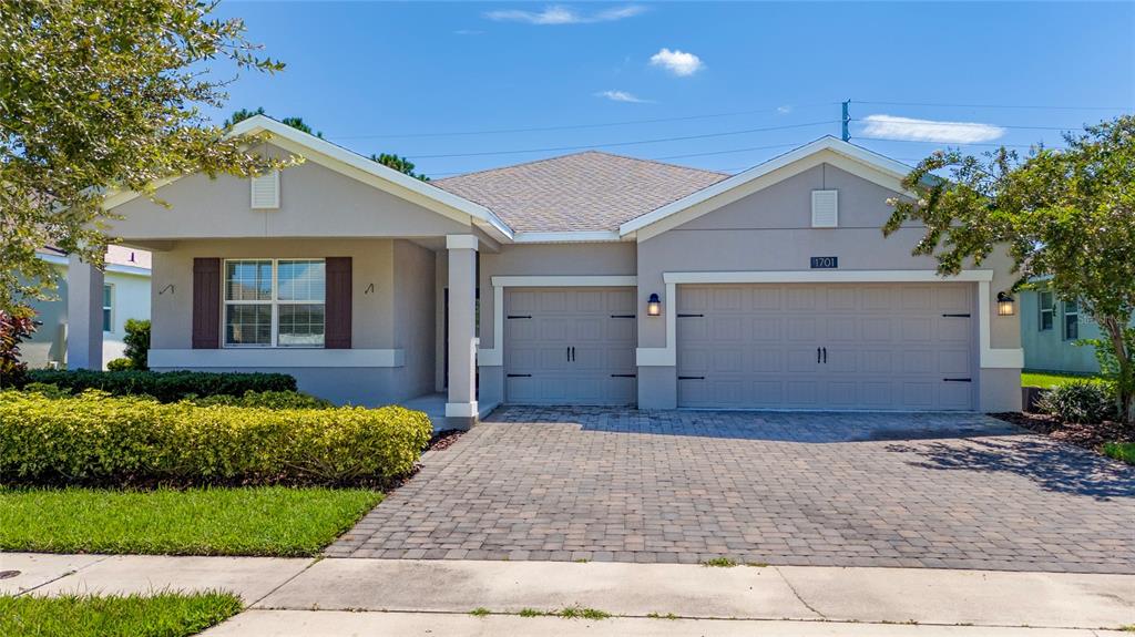 1701 Snapper Street St. Cloud, FL 34771 - Photo 1 of 29 a front view of a house with a yard