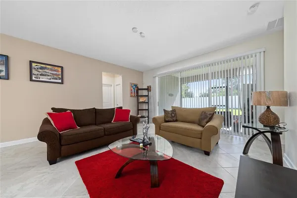 a living room with furniture and a window