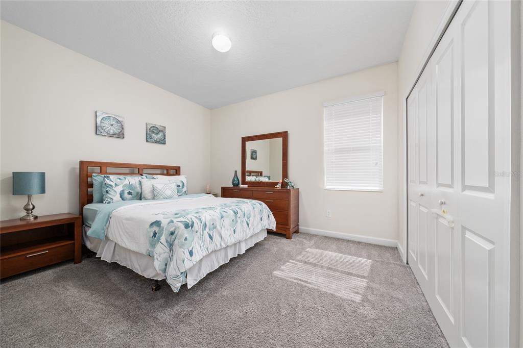 1701 Snapper Street St. Cloud, FL 34771 - Photo 15 of 29 a bedroom with a bed and a window