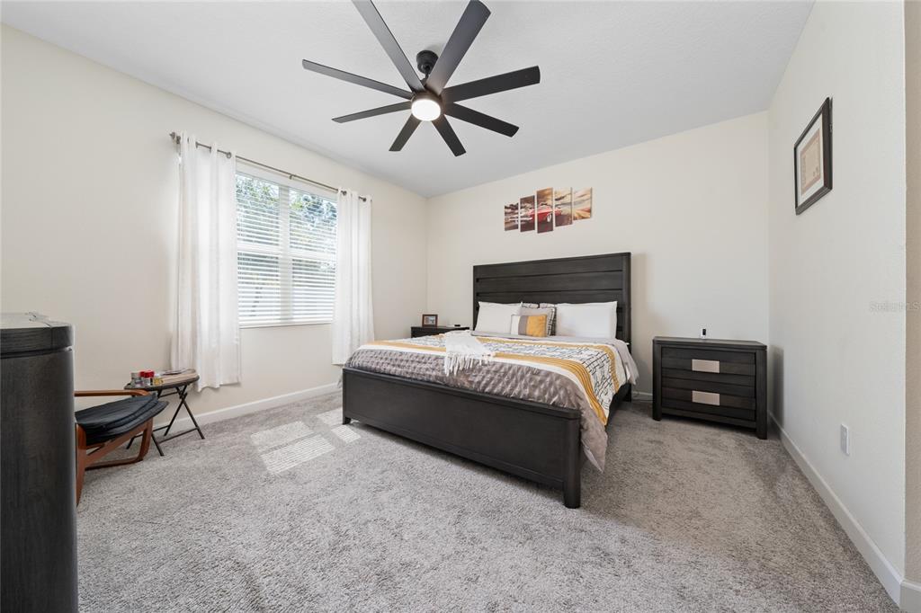 1701 Snapper Street St. Cloud, FL 34771 - Photo 18 of 29 a bedroom with a bed and a window