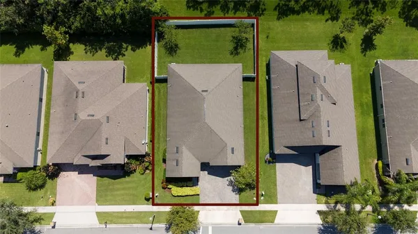 an aerial view of a house with a swimming pool