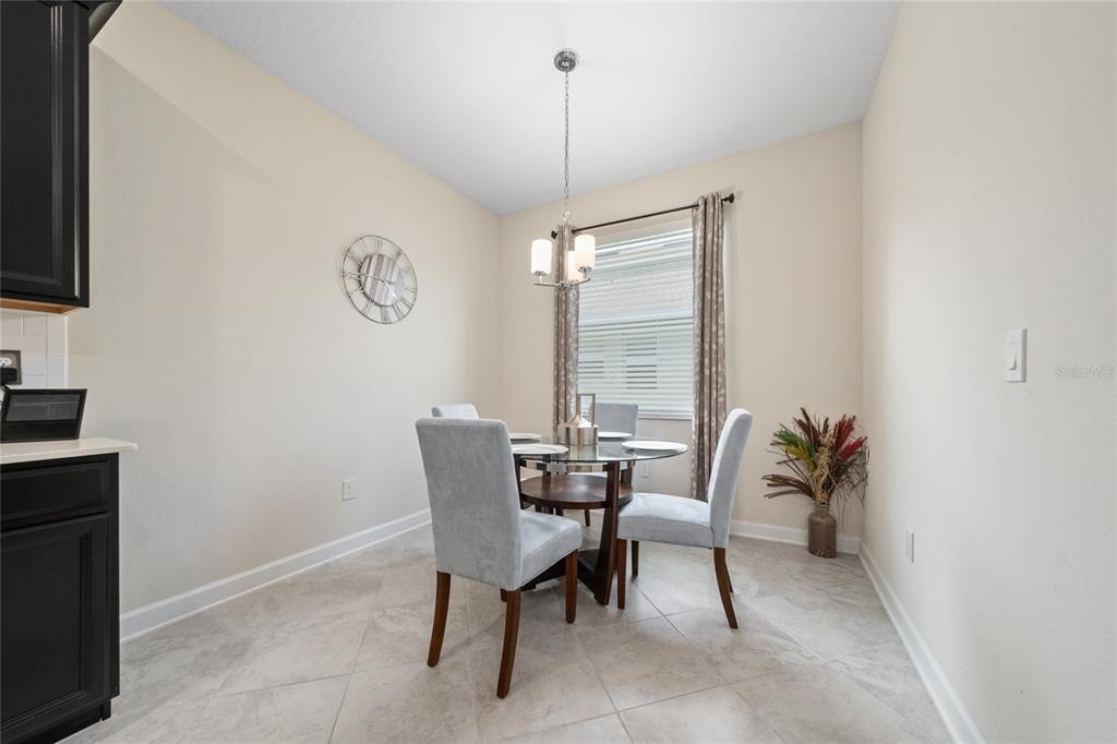 1701 Snapper Street St. Cloud, FL 34771 - Photo 8 of 29 a dining room with furniture and window