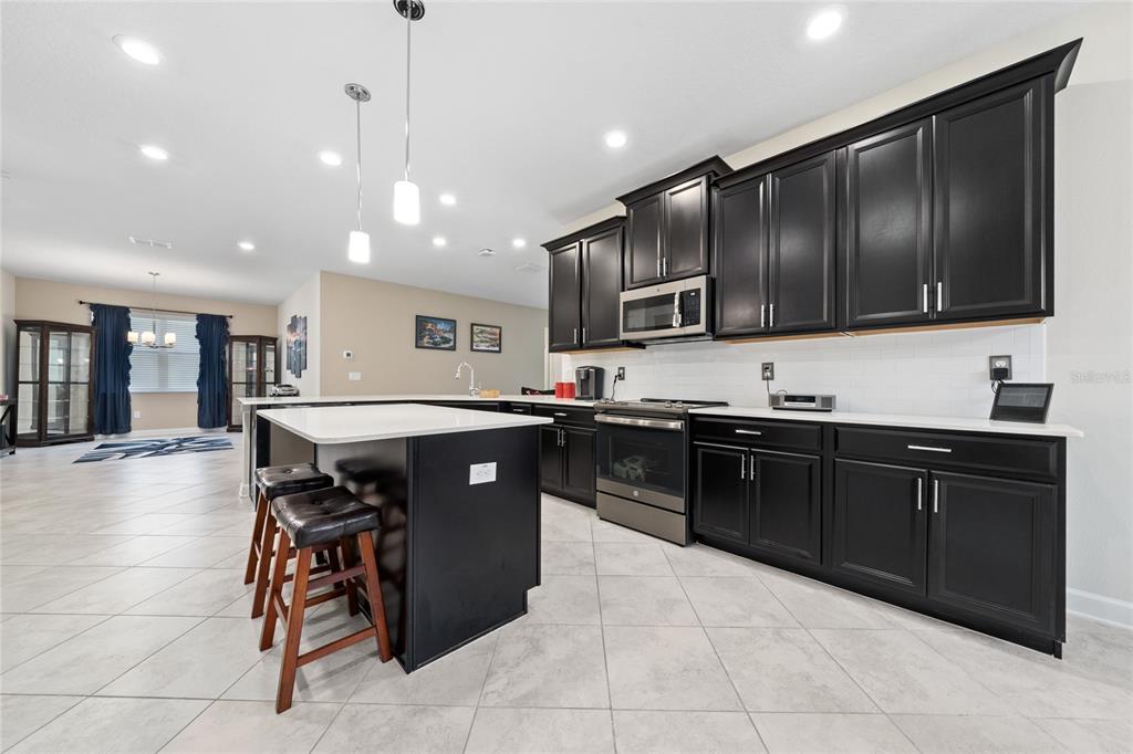 1701 Snapper Street St. Cloud, FL 34771 - Photo 9 of 29 a kitchen with a sink and cabinets