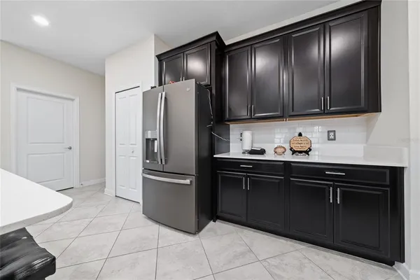 a kitchen with granite countertop stainless steel appliances and cabinets
