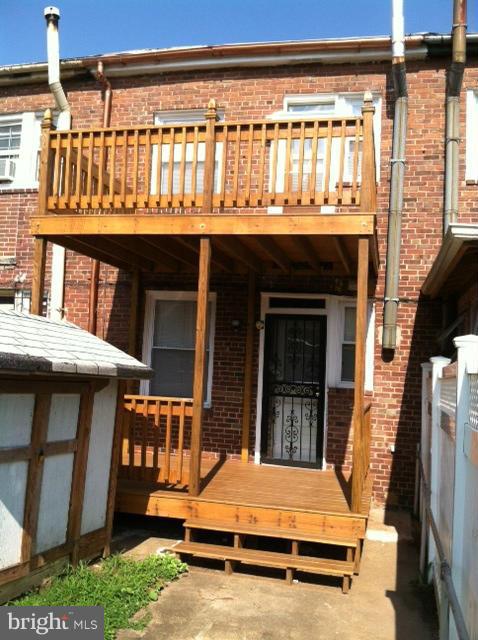 3218 8th Street Northeast Washington, DC 20017 - Photo 3 of 6 a backyard of a house with barbeque oven table and chairs