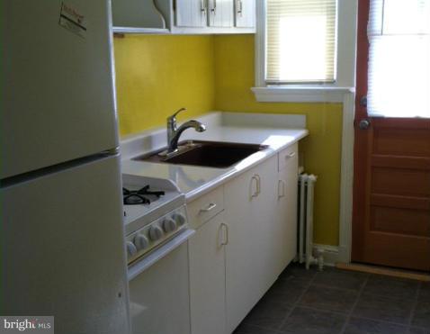3218 8th Street Northeast Washington, DC 20017 - Photo 5 of 6 a utility room with a sink a washer and dryer