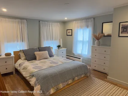 a bedroom with a bed and furniture