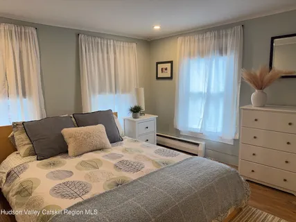 a bedroom with a bed and cabinets