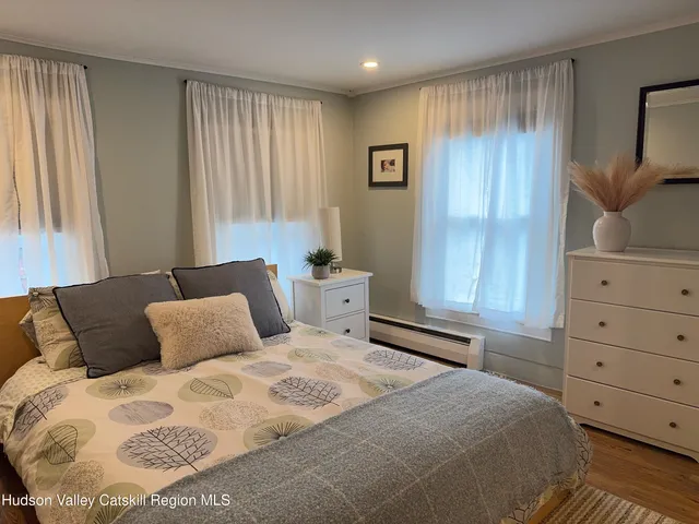 a bedroom with a bed and cabinets
