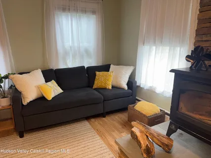 a living room with furniture and a rug