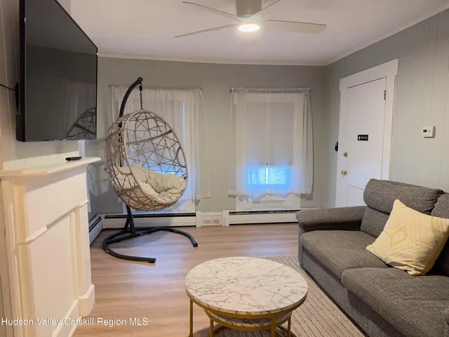 a table with potted plant and a wooden floor