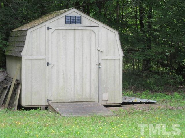 9565 George Ruff Road Bullock, NC 27507 - Photo 12 of 15 a view of backyard of house