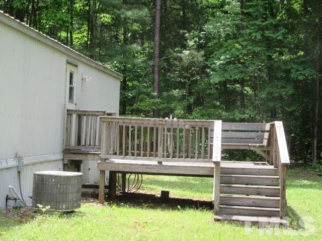 9565 George Ruff Road Bullock, NC 27507 - Photo 3 of 15 a view of house with a yard from a balcony