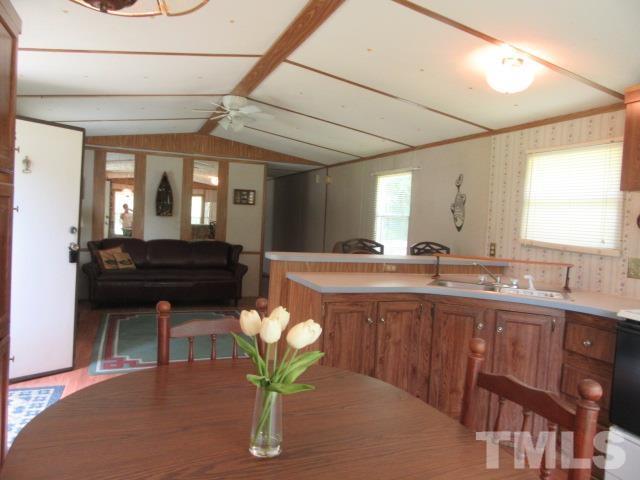 9565 George Ruff Road Bullock, NC 27507 - Photo 4 of 15 a kitchen with a sink cabinets and wooden floor