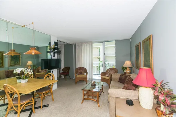 a living room with furniture and a table
