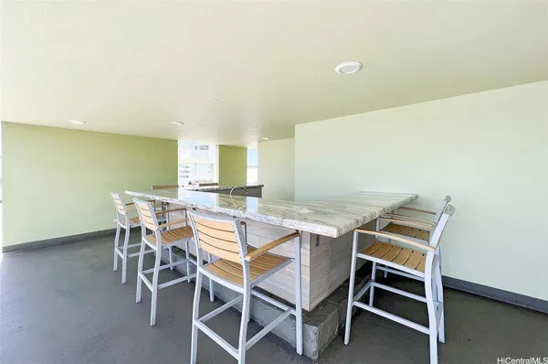 a view of a dining room with furniture and a window