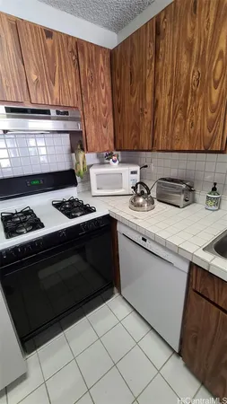 a kitchen with a stove and a sink