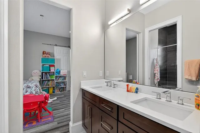 a bedroom with furniture and a window