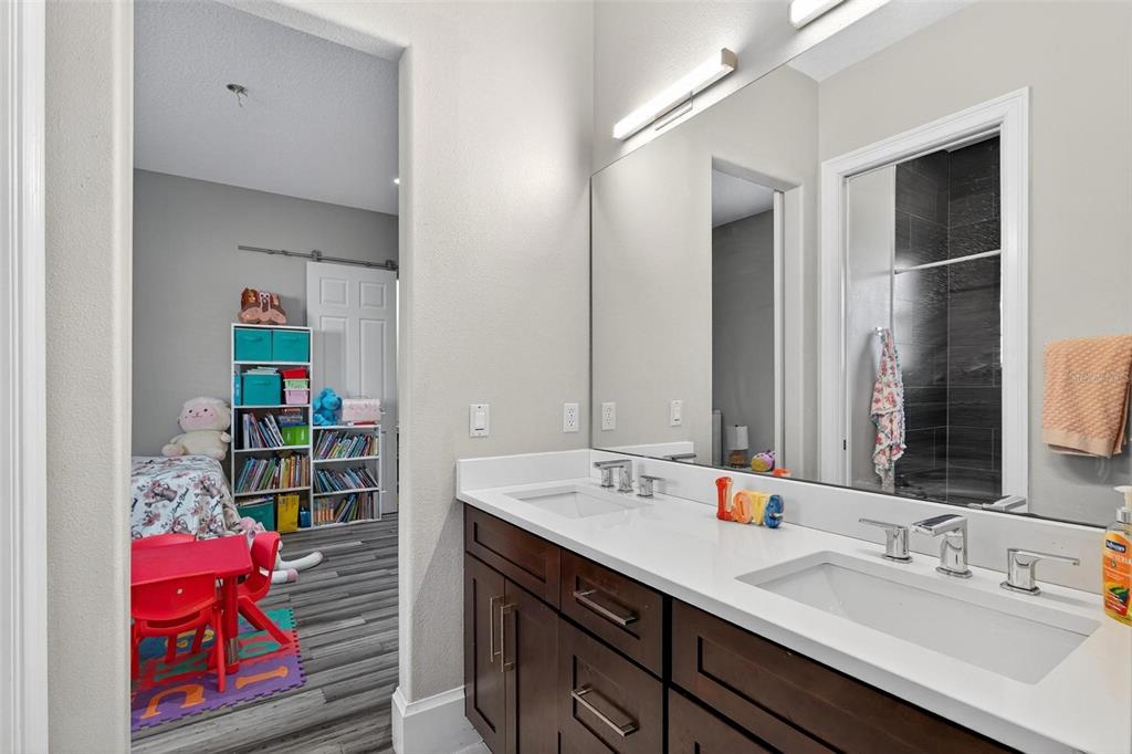 11015 Hawkshead Court Windermere, FL 34786 - Photo 11 of 90 a bathroom with a sink double vanity and a mirror