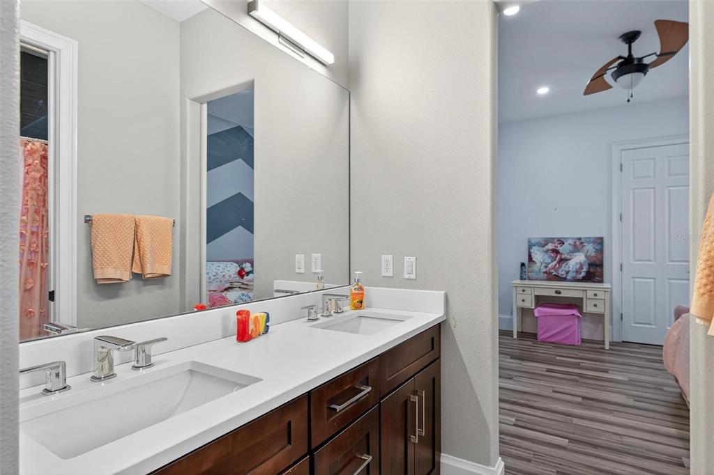 11015 Hawkshead Court Windermere, FL 34786 - Photo 12 of 90 a bathroom with a sink double vanity and a tub