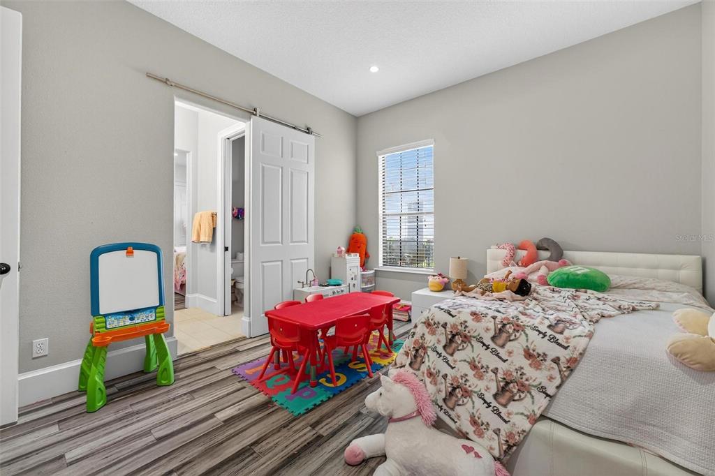 11015 Hawkshead Court Windermere, FL 34786 - Photo 16 of 90 a bedroom with furniture and a window