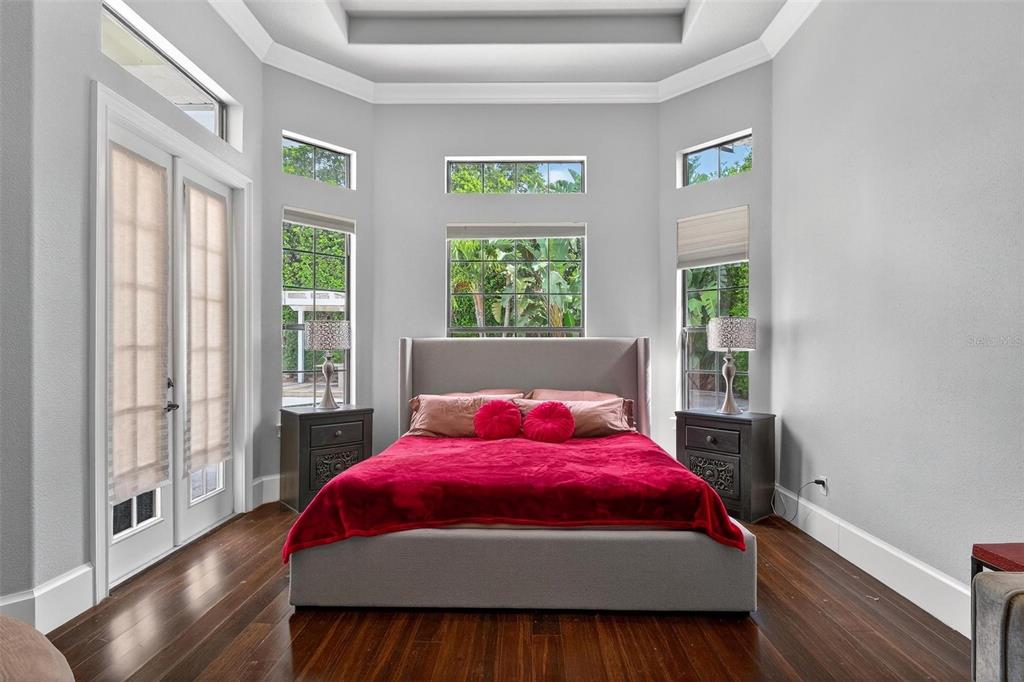 11015 Hawkshead Court Windermere, FL 34786 - Photo 24 of 90 a bedroom with a bed and wooden floor