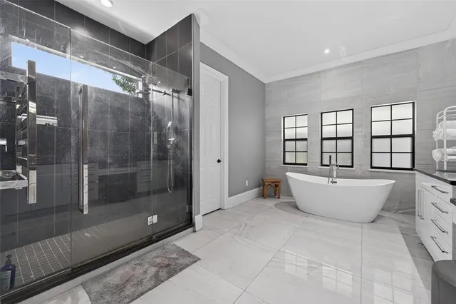 a kitchen with a table chairs stove and cabinets