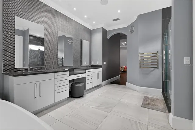 a view of a dining room with furniture and a chandelier