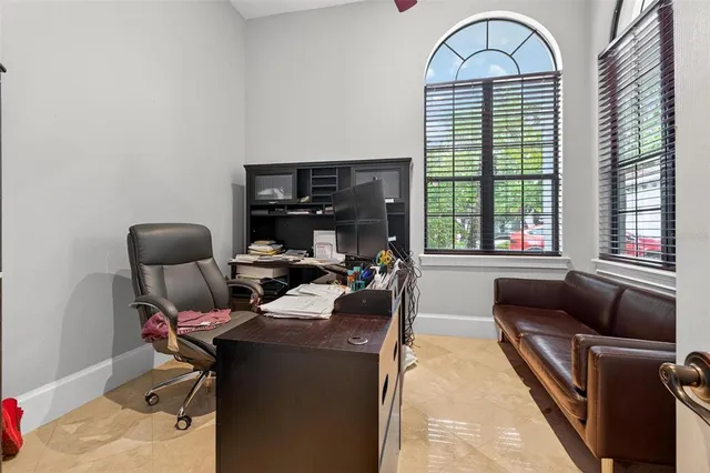a kitchen with stainless steel appliances a sink a stove and white cabinets