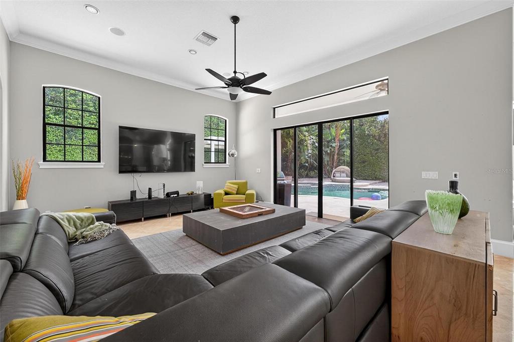 11015 Hawkshead Court Windermere, FL 34786 - Photo 33 of 90 a living room with furniture and a flat screen tv
