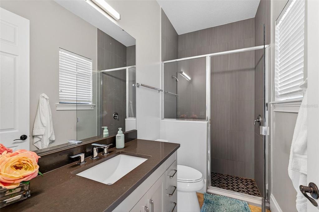 11015 Hawkshead Court Windermere, FL 34786 - Photo 38 of 90 a bathroom with a sink a toilet and a mirror