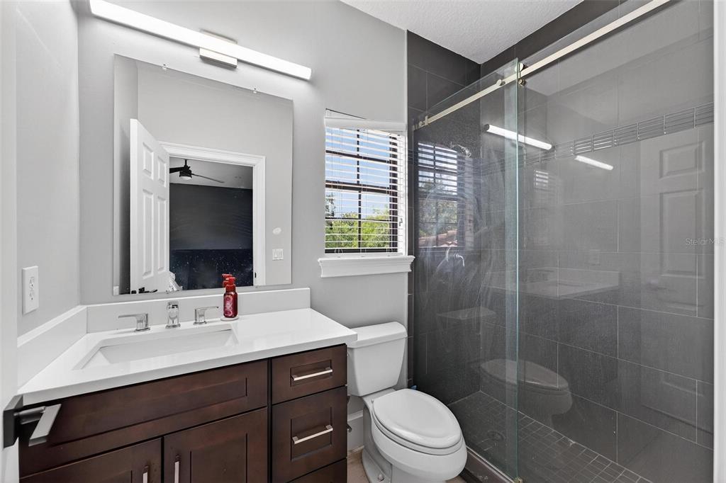 11015 Hawkshead Court Windermere, FL 34786 - Photo 42 of 90 a bathroom with a sink vanity mirror and toilet