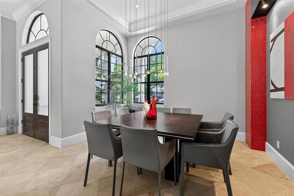 11015 Hawkshead Court Windermere, FL 34786 - Photo 43 of 90 a dining room with furniture a chandelier and wooden floor